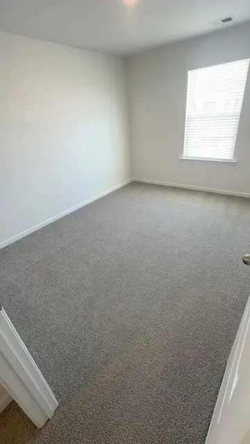 Freshly cleaned carpet after Velvo hot-water extraction — move-in ready bedroom in Fort Mill SC